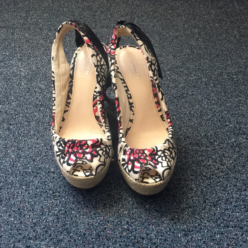 Adorable open toe, sling back coach wedges.